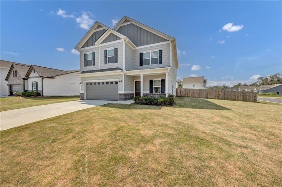 Front exterior of a new home in , Rome, GA, highlighting curb appeal (Image 2). Front exterior of a new home in , Rome, GA, highlighting curb appeal (Image 2).