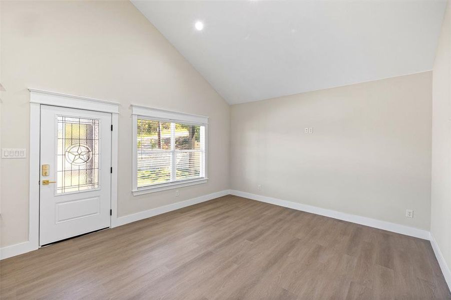 High ceilings and laminate wood flooring