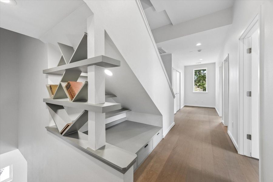 Thoughtful architectural details include custom built in shelving, creating a functional display feature with modern character. Thoughtful architectural details include custom built in shelving, creating a functional display feature with modern character.