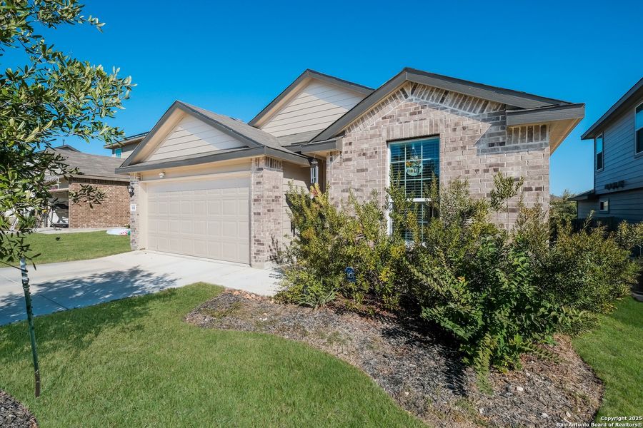 Front exterior of a new home in Redbird Ranch, San Antonio, TX, highlighting curb appeal (Image 24).
