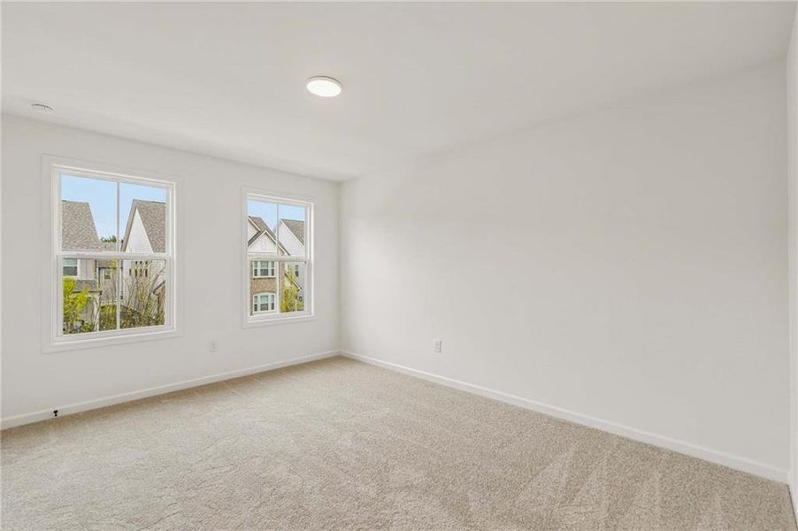 Spacious, unfurnished interior of a new home in Eastlyn Crossing, Flowery Branch (Image 27).