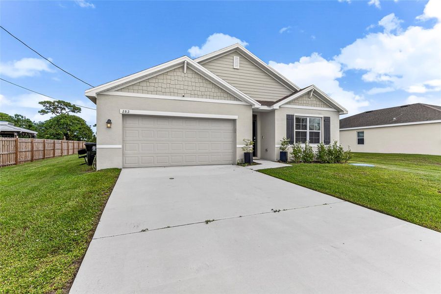 Front exterior of a new home in , Port St. Lucie, FL, highlighting curb appeal (Image 20). Front exterior of a new home in , Port St. Lucie, FL, highlighting curb appeal (Image 20).