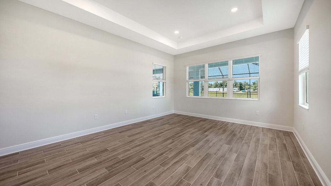Spacious, unfurnished interior of a new home in Canoe Creek Real Estate and Homes for Sale in Parrish, FL - Neal Communities, Parrish (Image 54).