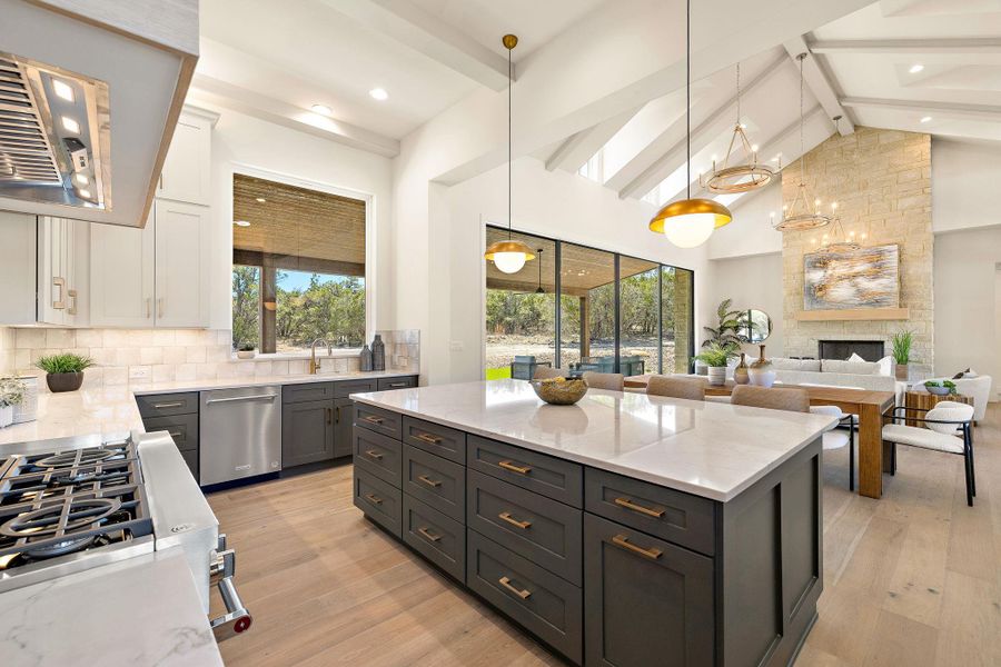 Kitchen featuring range hood, stainless steel dishwasher, decorative backsplash, light wood finished floors, and beamed ceiling