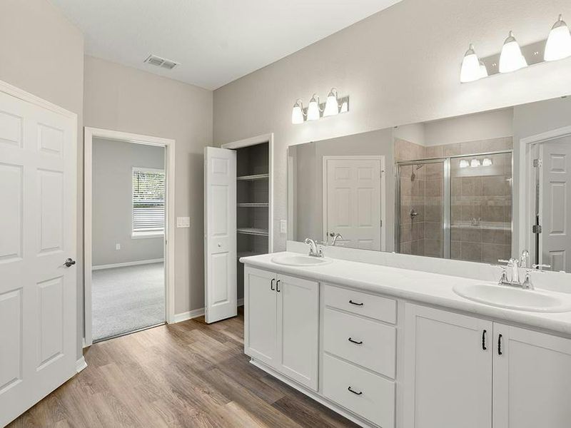 Your suite is complete with a walk-in closet and large en-suite bath.