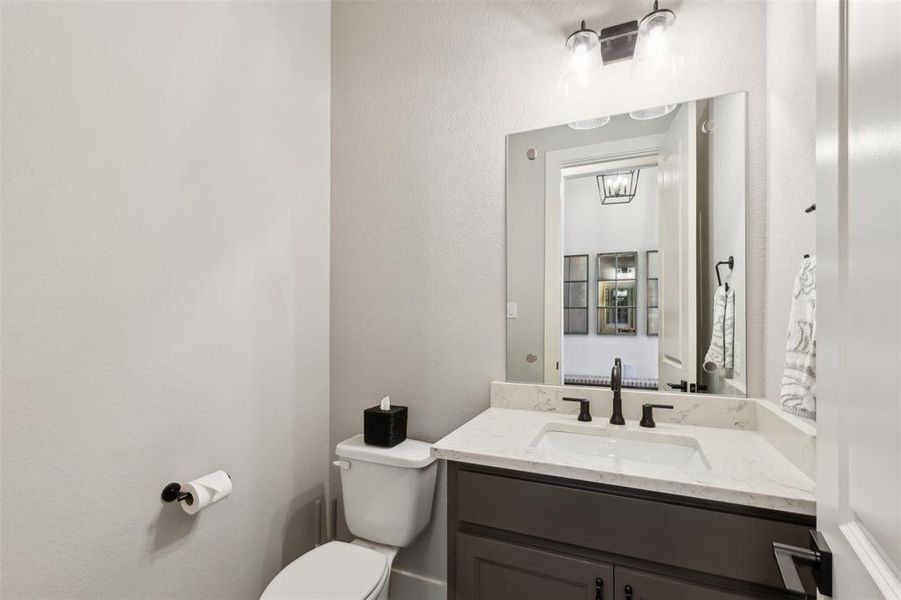 Powder Bathroom with vanity and toilet