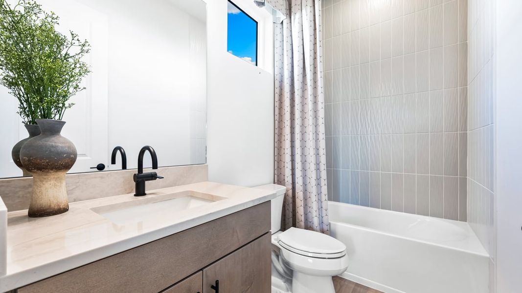 Furnished interior view inside a new home in Esplanade by the Islands, Naples (Image 22).