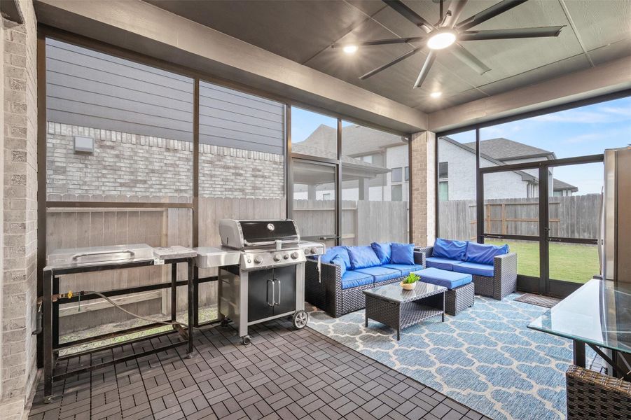This incredible screened in patio was designed for year round outdoor living and entertaining. Featuring a spacious covered lounge area, oversized modern ceiling fan, and outdoor grilling setup, it’s the perfect space for relaxing evenings or weekend cookouts. The full screened enclosure lets you enjoy the outdoors comfortably in every season.