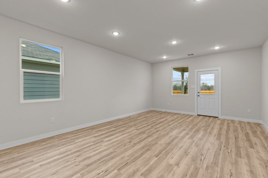 A room with a wood floor and a wood floor.