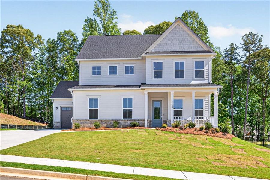 Front exterior of a new home in Traditions of Braselton, Jefferson, GA, highlighting curb appeal (Image 2). Front exterior of a new home in Traditions of Braselton, Jefferson, GA, highlighting curb appeal (Image 2).