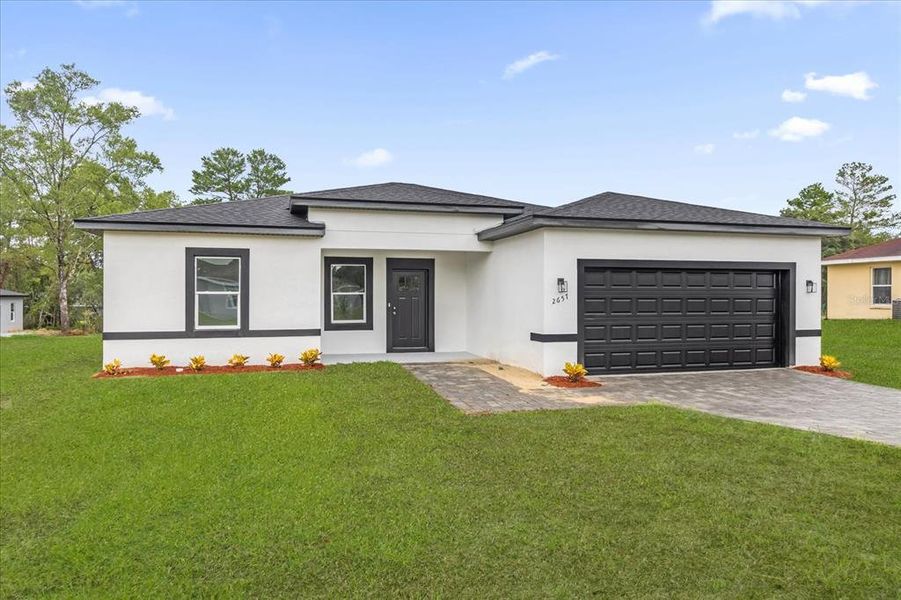 Front exterior of a new home in , Ocala, FL, highlighting curb appeal (Image 2).