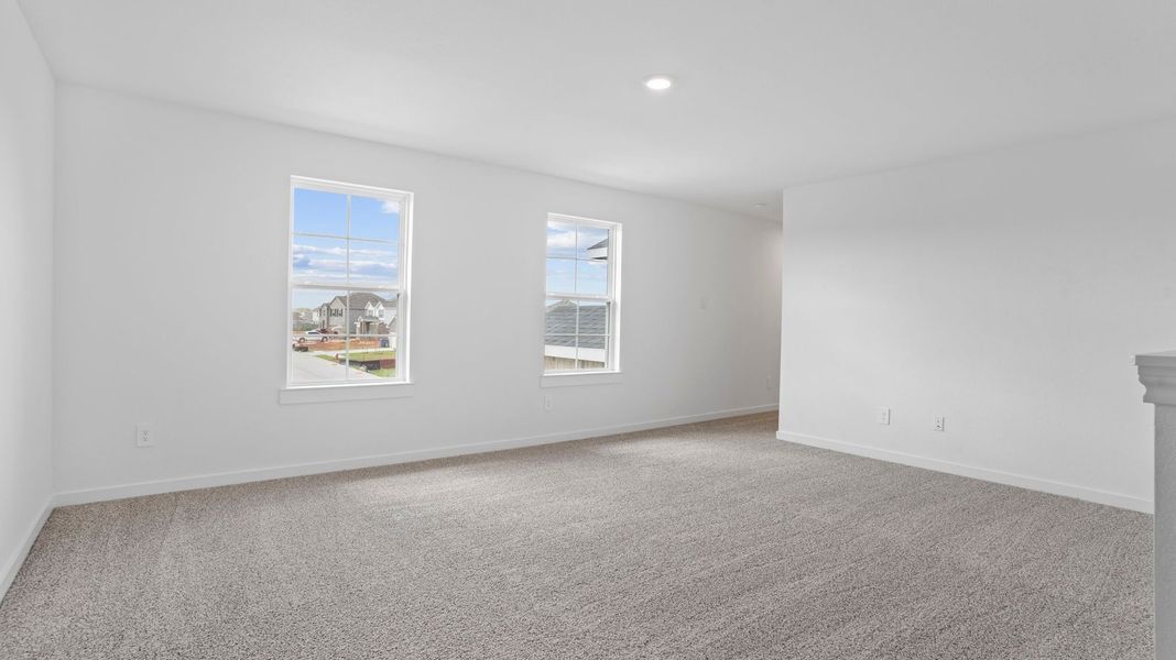 Representative unfurnished interior of a home built from the Mitchell by D.R. Horton in Caldwell Crossing, Iowa Colony (Image 19).