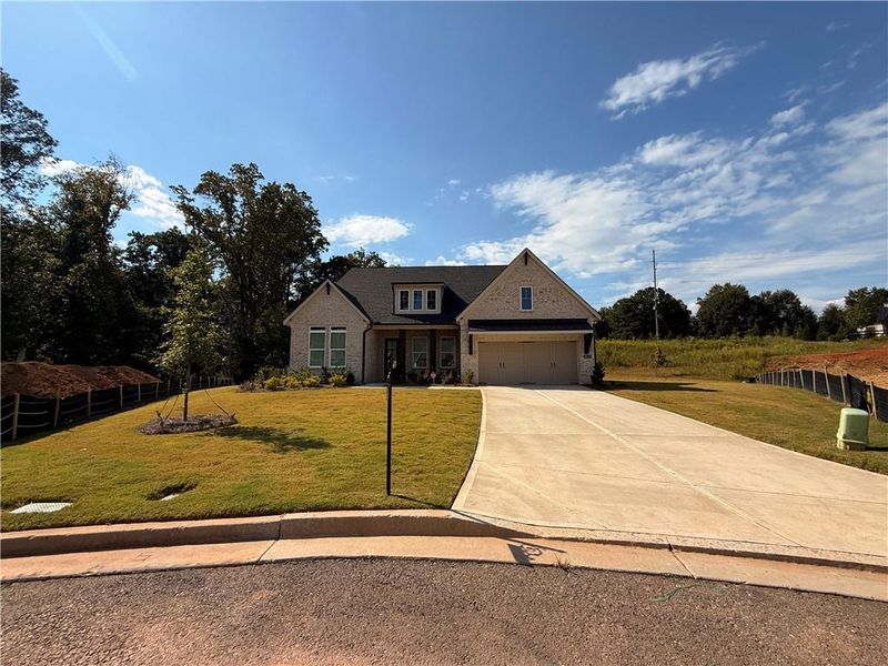 Front exterior of a new home in , Cumming, GA, highlighting curb appeal (Image 28).