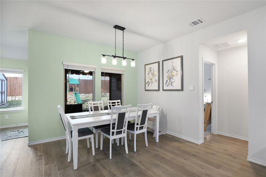 Dining space with wood finished floors