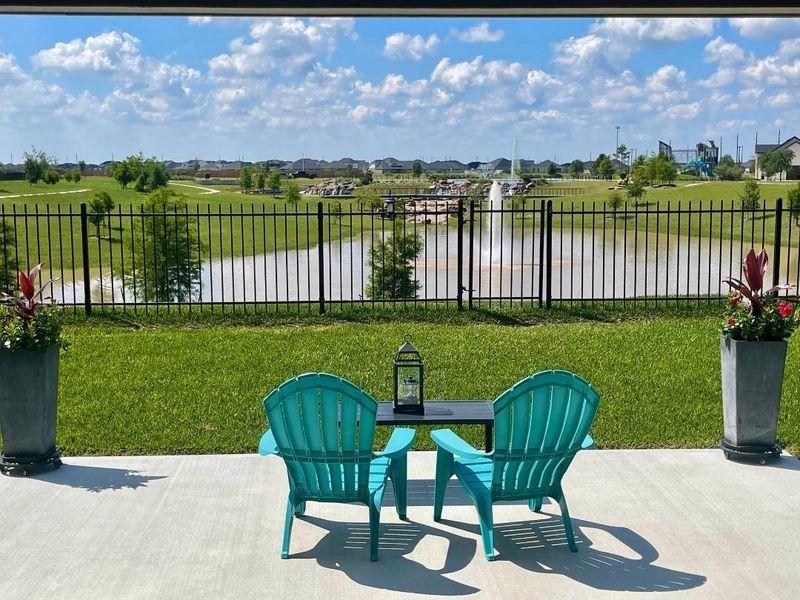 This is the view from your backyard!  It looks across the pond to a waterfall flowing towards you.