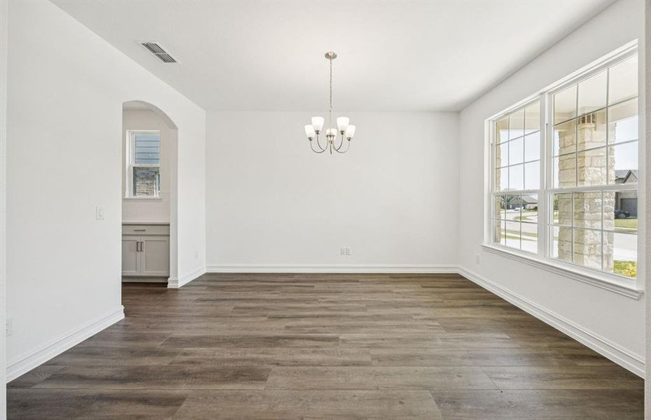 Formal dining room with large windows Formal dining room with large windows