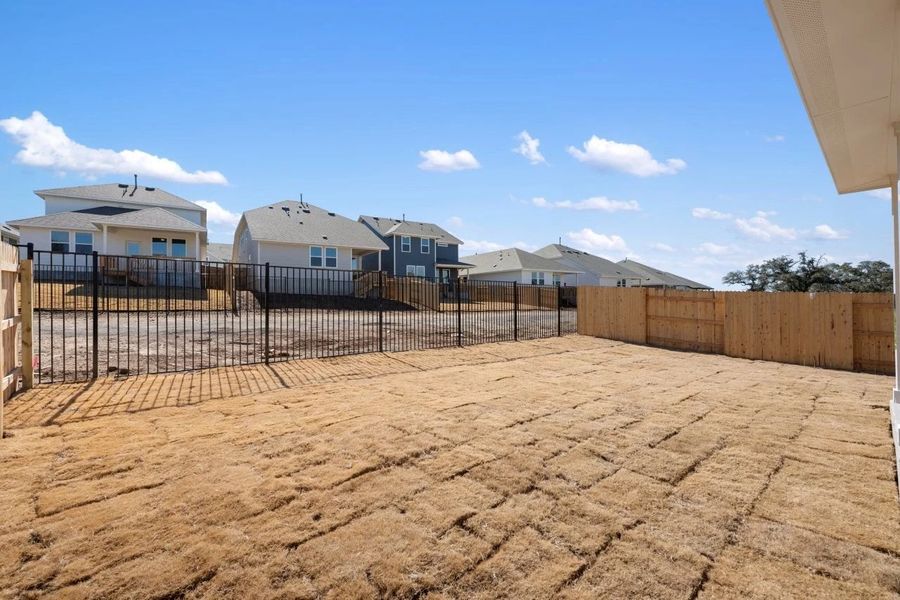 Exterior details and patio area of a home in Cannon Ranch, Dripping Springs (Image 24).