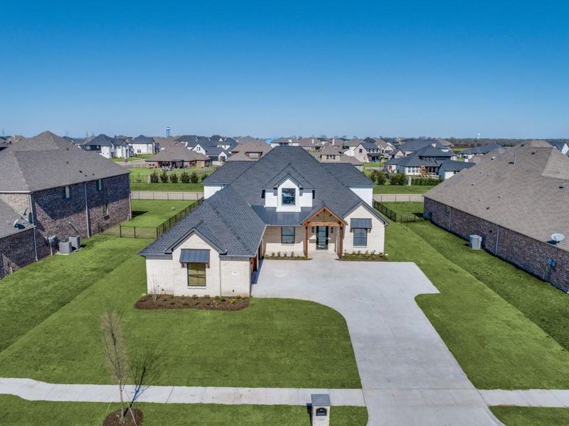 Front exterior of a new home in , Gunter, TX, highlighting curb appeal (Image 26).