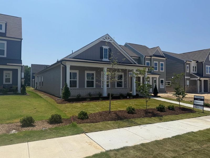 Front exterior of a new home in The Point, Rolesville, NC, highlighting curb appeal (Image 18). Front exterior of a new home in The Point, Rolesville, NC, highlighting curb appeal (Image 18).