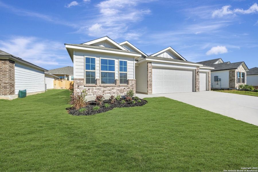 Front exterior of a new home in Greenspoint Heights, Seguin, TX, highlighting curb appeal (Image 17).