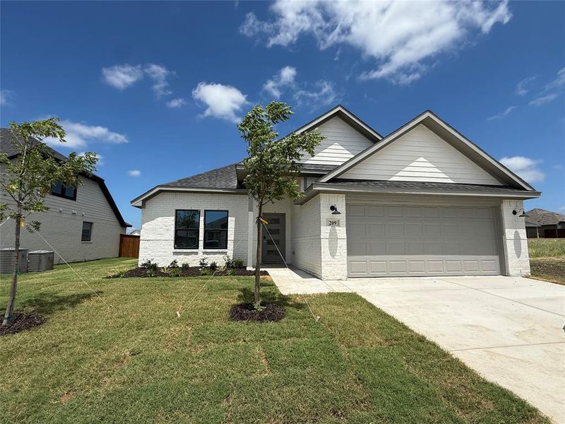 Front exterior of a new home in Stillwater Lake Estates, Godley, TX, highlighting curb appeal (Image 17). Front exterior of a new home in Stillwater Lake Estates, Godley, TX, highlighting curb appeal (Image 17).