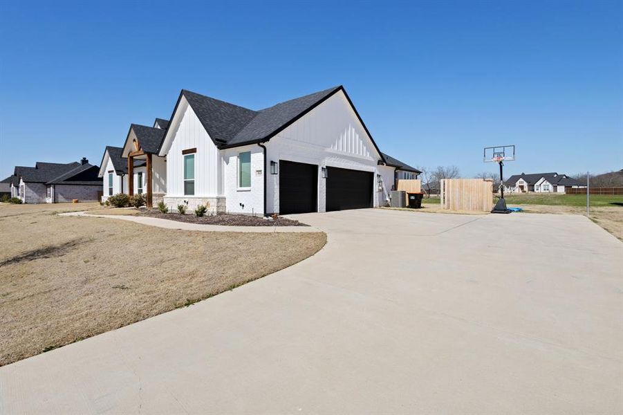 Front exterior of a new home in , Midlothian, TX, highlighting curb appeal (Image 25).