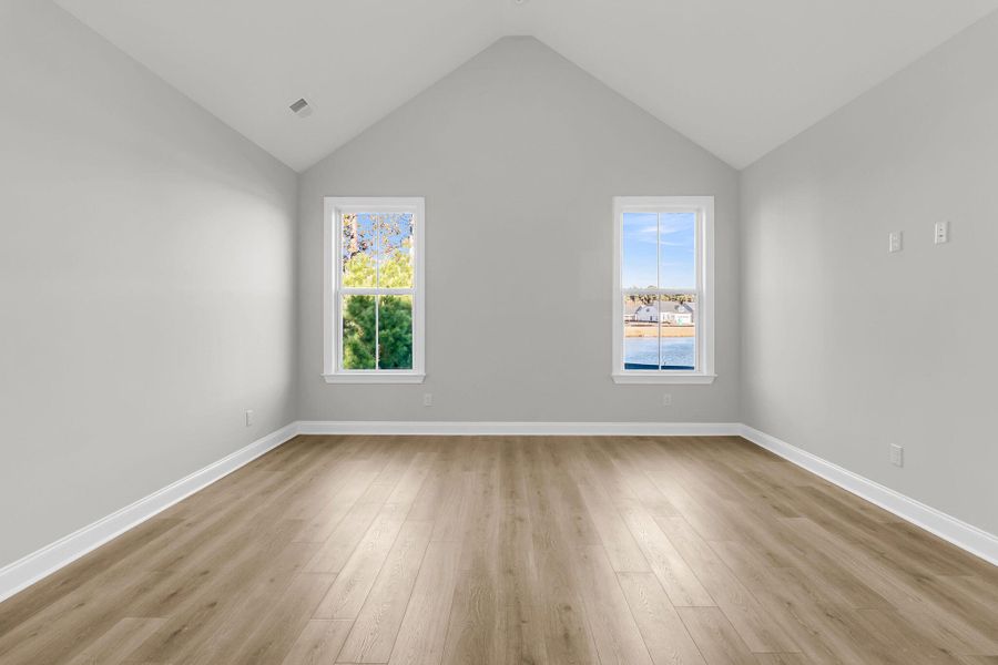 Spacious, unfurnished interior of a new home in Tidewater at Lakes of Cane Bay, Summerville (Image 16).