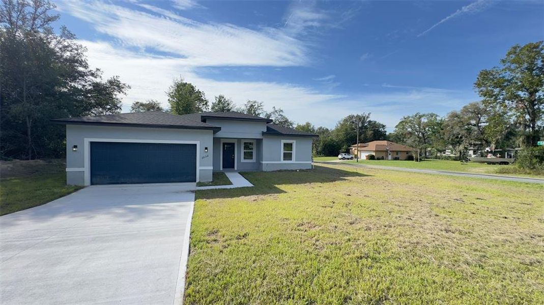 Front exterior of a new home in , Dunnellon, FL, highlighting curb appeal (Image 15).