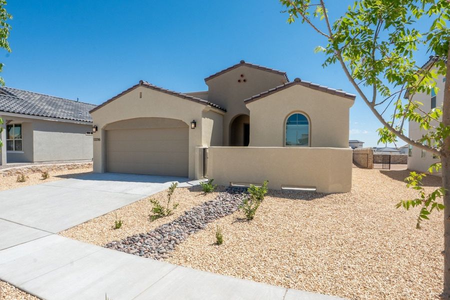 Front exterior of a new home in Emerald Estates, El Paso, TX, highlighting curb appeal (Image 2).
