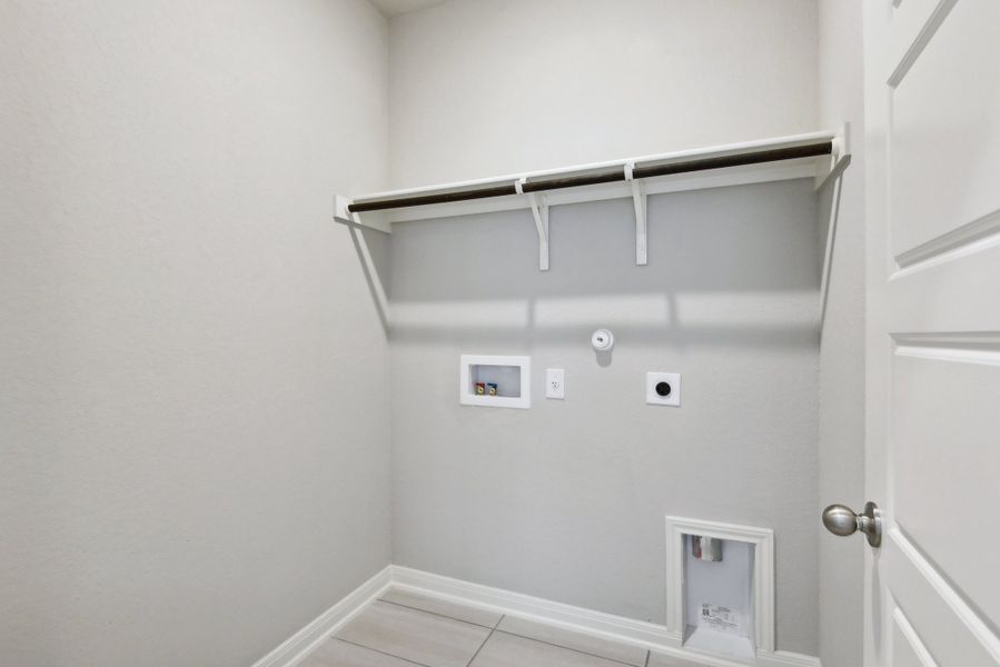 Laundry room in the Medina floorplan at a Meritage Homes community.