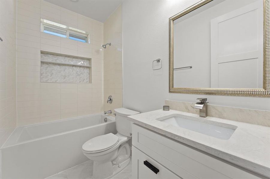 Bathroom featuring vanity and bathing tub / shower combination