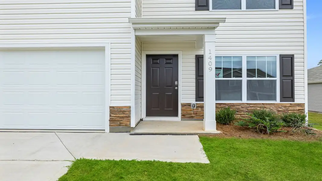 Exterior details and patio area of a home in Lakestone, Woodruff (Image 3).