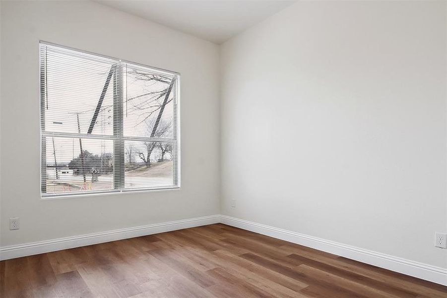 Empty room featuring hardwood / wood-style flooring