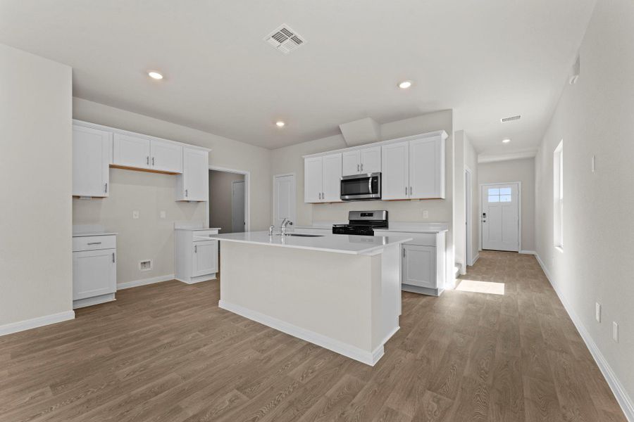 Furnished interior view inside a new home in Whisper South, San Marcos (Image 5).