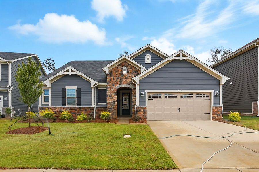Front exterior of a new home in Waxhaw Landing, Monroe, NC, highlighting curb appeal (Image 1).