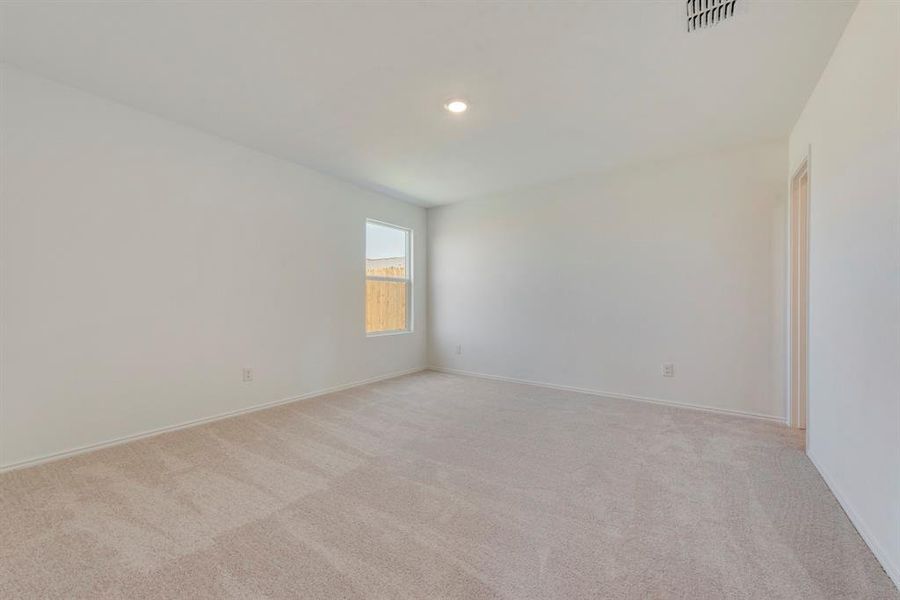 Unfurnished room with light colored carpet