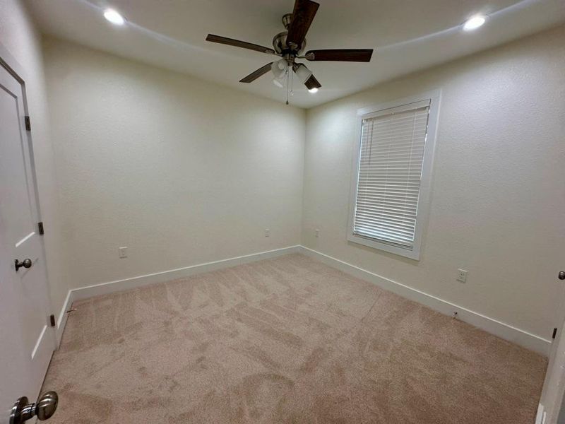 Spare room with light carpet, a ceiling fan, and recessed lighting