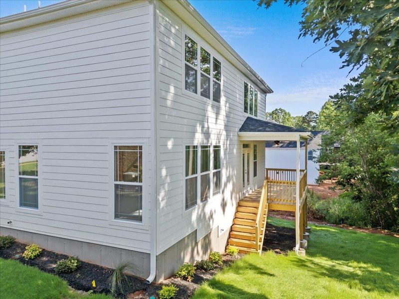 Front exterior of a new home in Lakeside at Blue Ridge Plantation, Taylors, SC, highlighting curb appeal (Image 26).