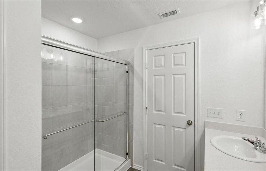 Owner's bath with oversized shower*real home pictured