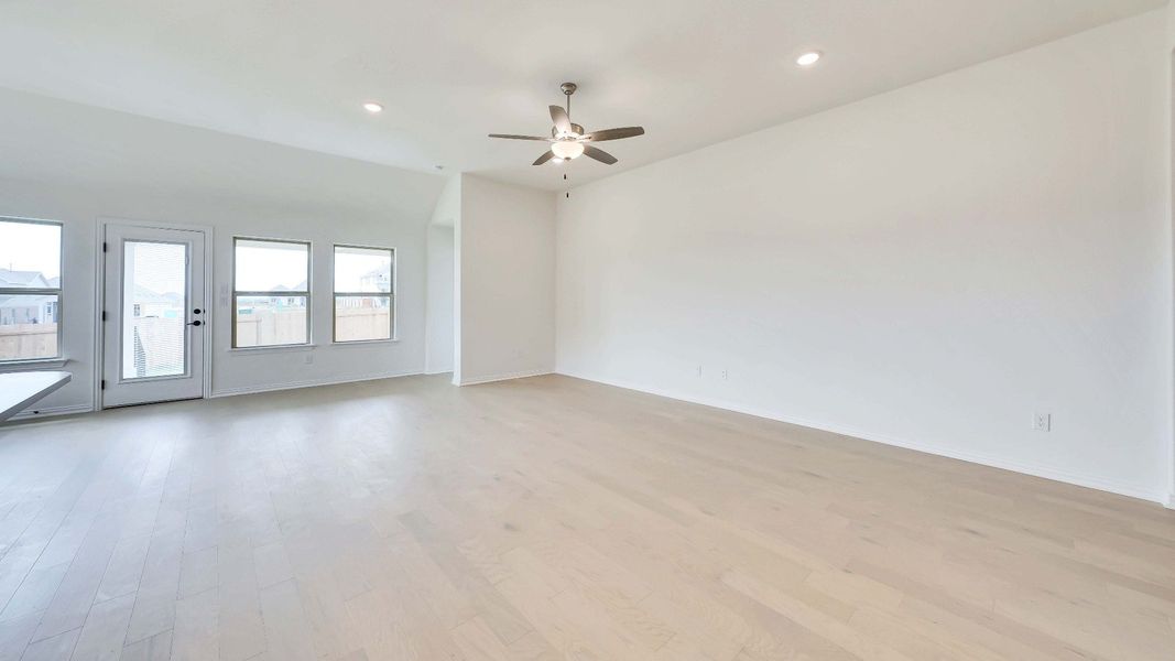 Representative furnished interior of a home built from the Palm by Brightland Homes in Sunterra, Katy (Image 6).