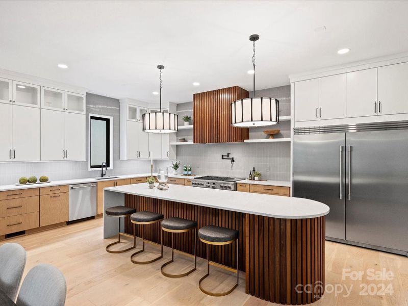 Chef's kitchen with stunning custom cabinetry and stainless appliances