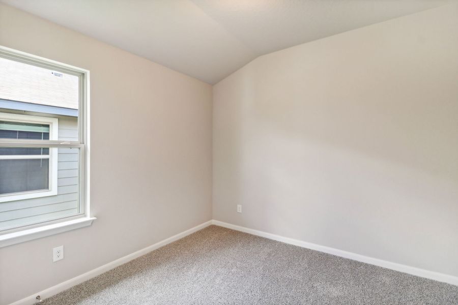 Guest bedroom in the Callaghan floorplan at a Meritage Homes community.