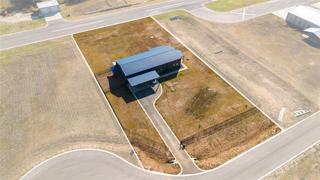 Aerial view of the property from street-side Aerial view of the property from street-side