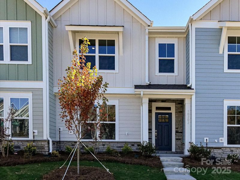 Exterior details and patio area of a home in North Creek Village - Townhomes, Huntersville (Image 19).