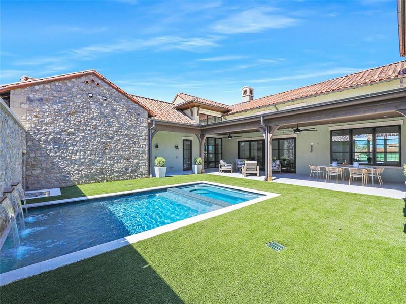 View of pool featuring ceiling fan, outdoor lounge area, a patio area, and a yard