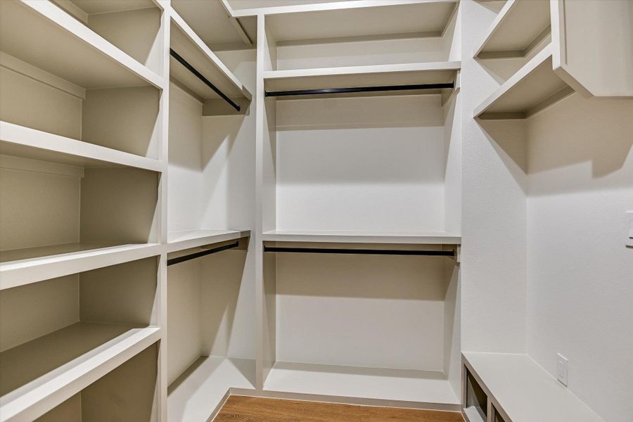 Ample hanging space and shelving in this primary closet will keep you neat and organized! Ample hanging space and shelving in this primary closet will keep you neat and organized!