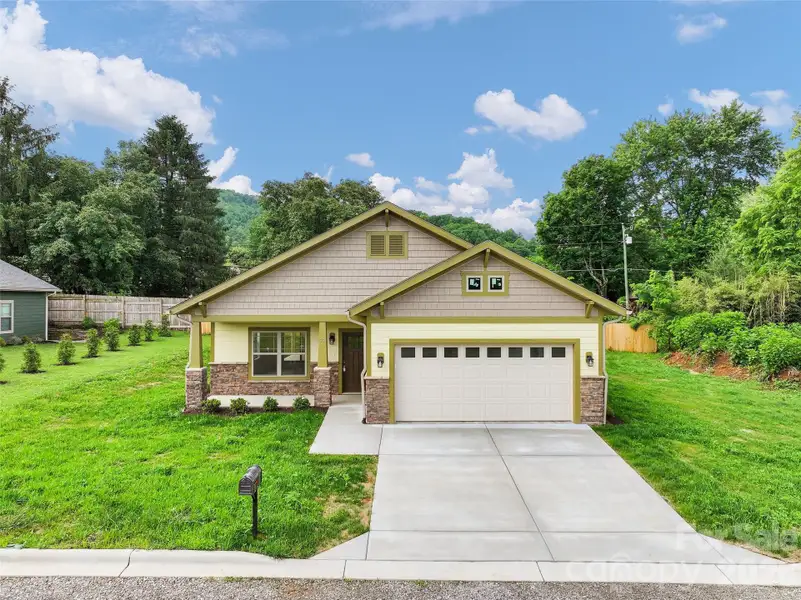 Front exterior of a new home in , Waynesville, NC, highlighting curb appeal (Image 16).