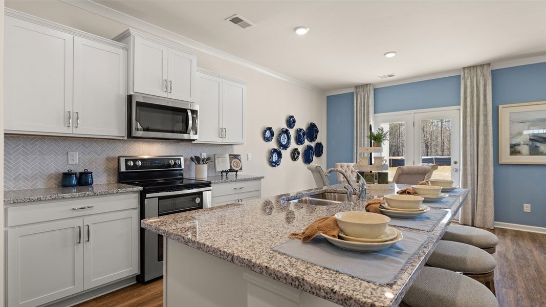 Representative furnished interior of a home built from the HAYDEN Express by D.R. Horton in WillowBrook, Winder (Image 12).