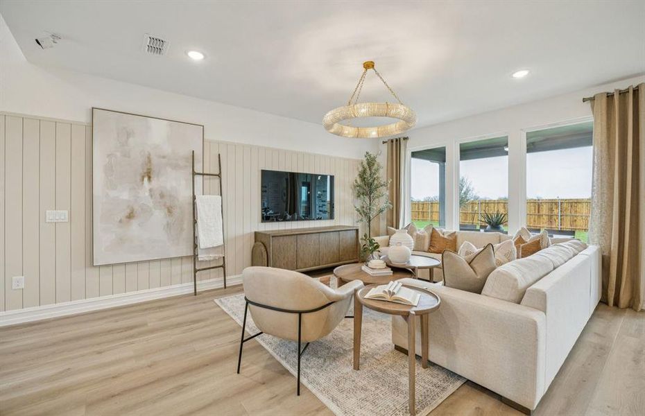 *Model Representation - Spacious gathering room with large windows