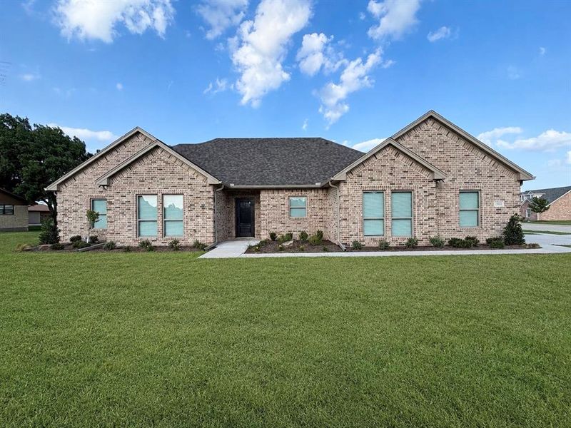 Front exterior of a new home in , Lindsay, TX, highlighting curb appeal (Image 25).